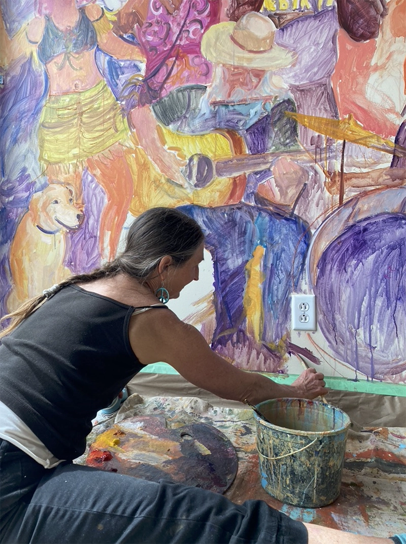 Professional painter and muralist Julie Wiegand working at Zydeco in Hermann, MO.